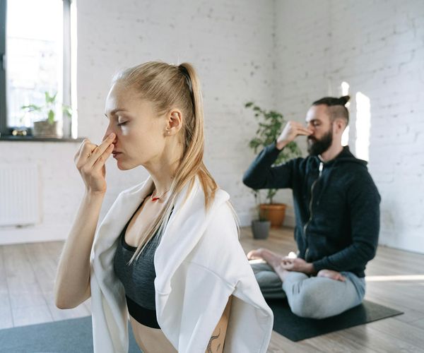 Cozy corner in a room with a yoga mat, ready for practice.